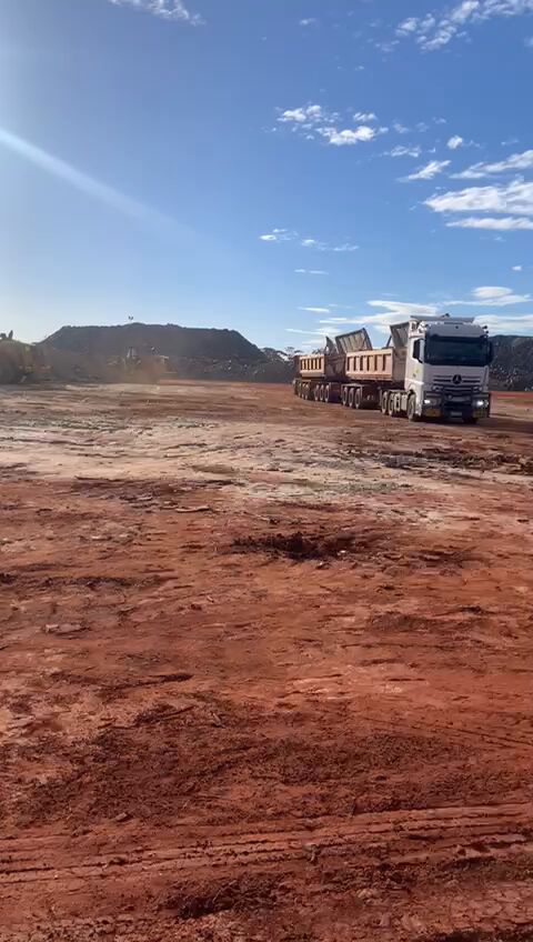 PSSG side tipper on a red-dirt loading pad