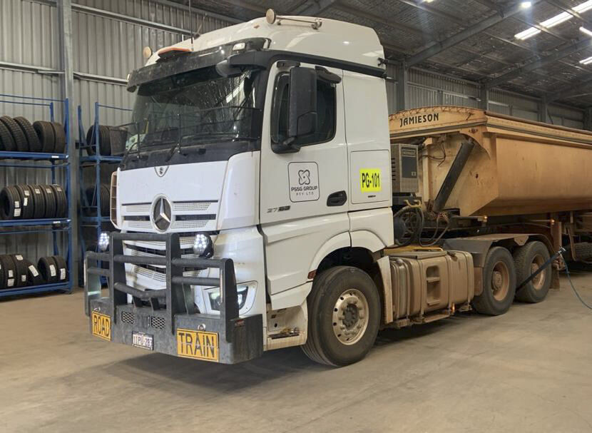 Mercedes-Benz prime mover with side tipper in the workshop